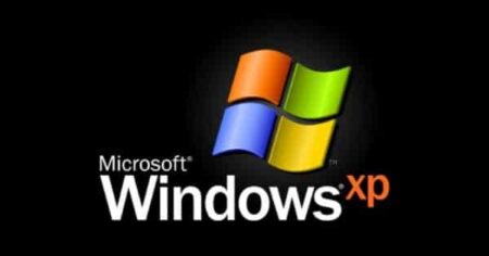 The Windows XP End of Life logo with four colored quadrants (blue, red, green, and yellow) on a black background, with the text "microsoft windows xp" below it.