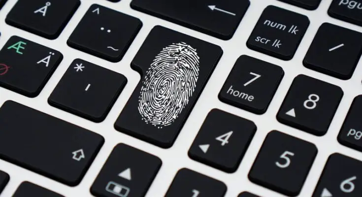 Close-up image of a laptop keyboard with a fingerprint icon on the enter key, symbolizing effective biometric security technology.