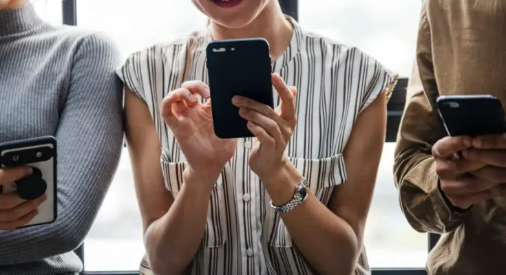 3 people on a cellphone