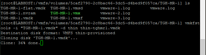 Screenshot of a command line interface displaying file operations. The screen shows VMware-related file listings and a process indicating 36% completion of converting VMware disk from thick to thin.