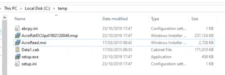 Screenshot of a file explorer window showing a folder view with files including "acroread.msi," "setup.exe," related to Adobe Reader, and others, with file types and sizes displayed.