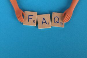 close up shot of scrabble tiles on a blue surface