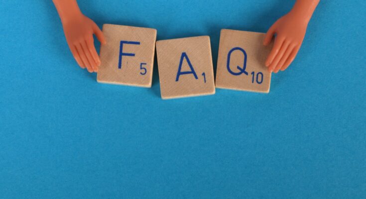 close up shot of scrabble tiles on a blue surface