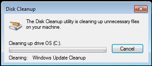 A screenshot of the disk cleanup utility window showing the progress of cleaning up unnecessary files on drive os (c:) including the WinSXS folder on Windows 7 SP1, with a "cancel