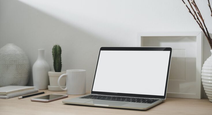 macbook-pro-on-brown-wooden-table-3815750