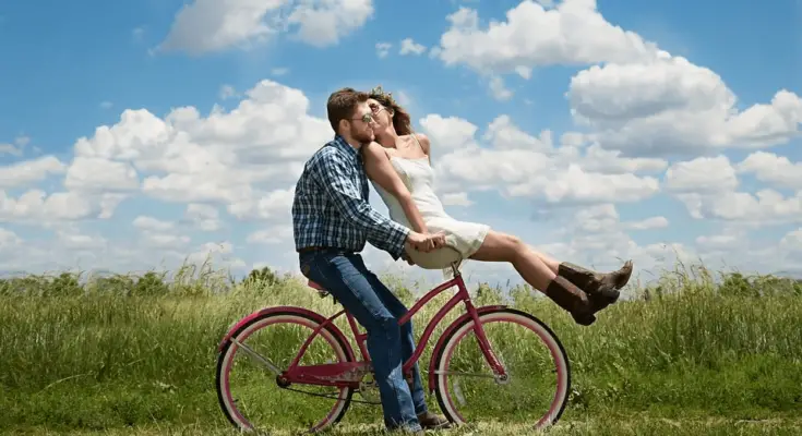 engagement couple romance on bike