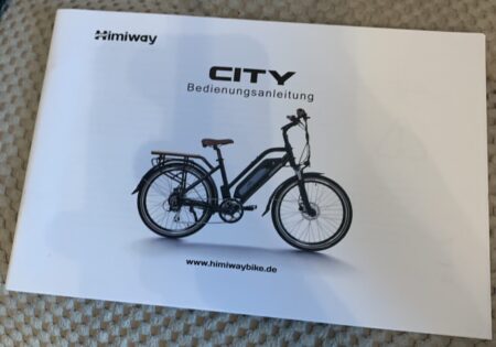 A white instruction manual titled 'Himiway City Pedelec' by Himiway with an illustration of a black electric bike on the cover. The brand's website, www.himiwaybike