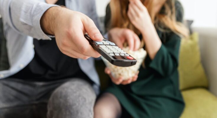 man holding remote control