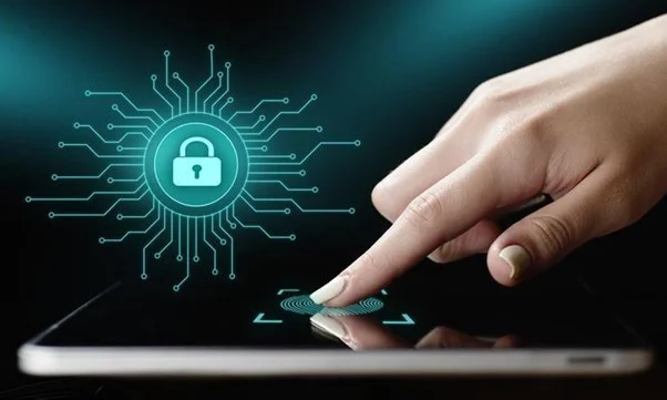 A hand touching a digital tablet, displaying a vibrant graphic of a lock symbol within a circuit, symbolizing data security or biometric authentication of personal information.