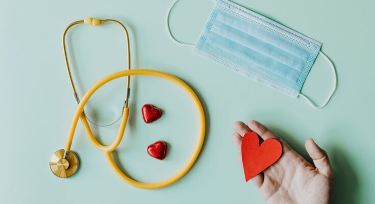 medical stethoscope and mask composed with red foiled chocolate hearts