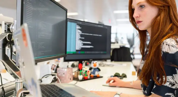 woman coding on computer