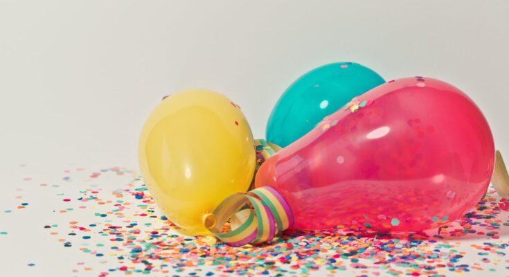 yellow pink and blue party balloons