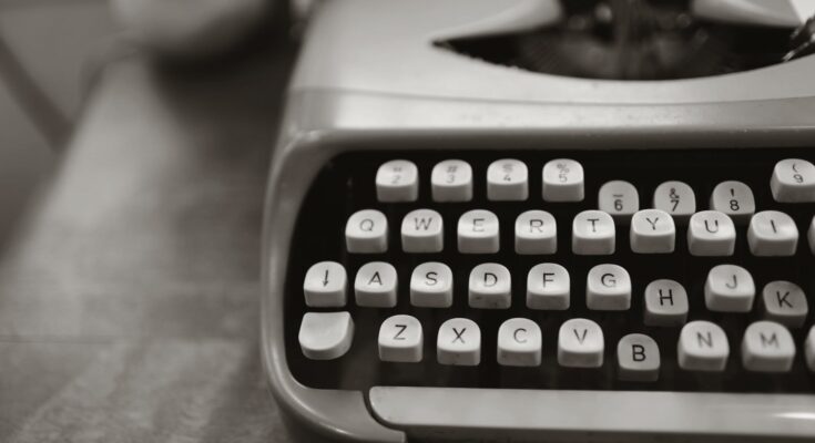 close up photo of gray typewriter