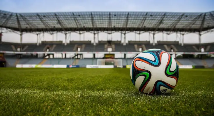 soccer ball on grass field during daytime