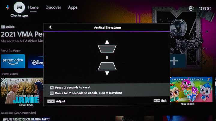 Smart tv screen displaying a "vertical keystone" adjustment setting menu with time displayed as 10:00, and various streaming apps like Prime Video and Disney+, connected to a BenQ GV30 ceiling