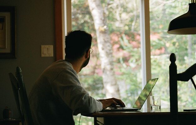 Man staring out of window