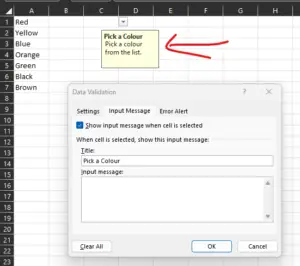 Screenshot of a Microsoft Excel spreadsheet with a data validation drop-down in cell b2, highlighted with a red arrow, displaying a tooltip saying "pick a colour from the list.